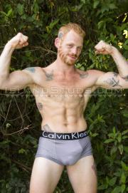Ginger-stud-Red-Robert-strips-naked-showing-belly-slapper-dick-low-hanging-big-balls-3-gay-porn-pics
