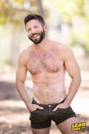 Sexy-hairy-muscle-hunk-Sean-Cody-Holden-strips-out-of-shorts-wanking-huge-thick-dick-0-gay-porn-pics