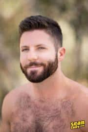 Sexy-hairy-muscle-hunk-Sean-Cody-Holden-strips-out-of-shorts-wanking-huge-thick-dick-4-gay-porn-pics